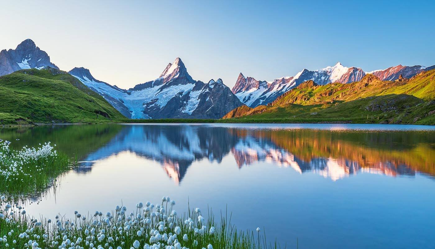 Swiss mountains and lake reflecting purity, nature, and Swiss innovation behind Rivolab skincare